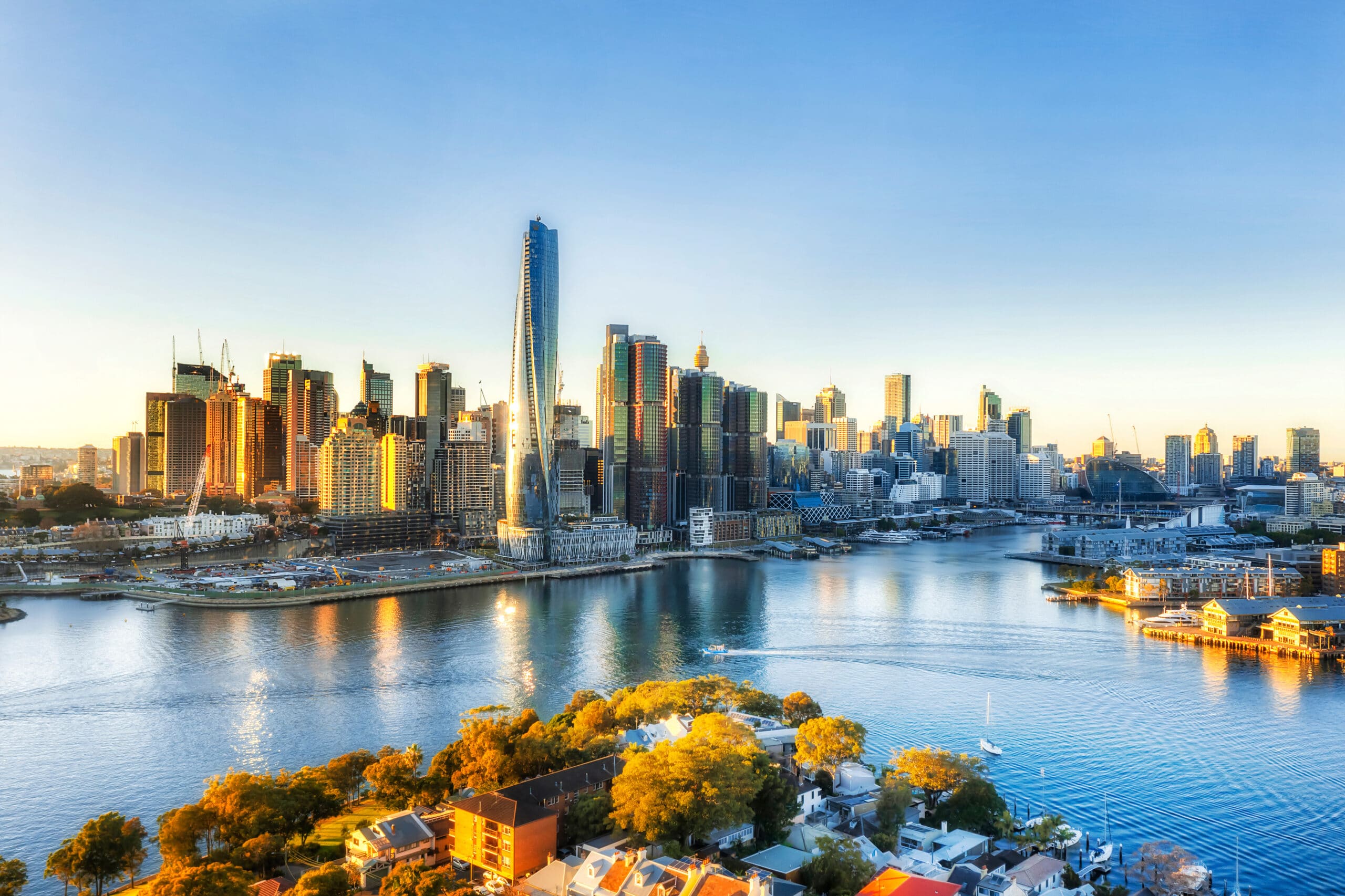 A wide shot of Barangaroo city in Sydney where the edge of the city meets the water.