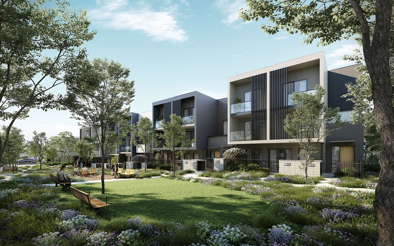 Modern townhouse development overlooking landscaped community green space with native planting and pedestrian-friendly streets