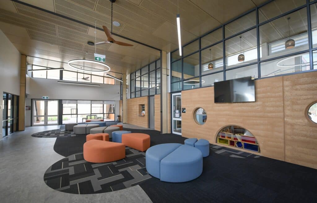 Contemporary early learning centre interior with natural timber finishes, flexible learning spaces, and child-friendly educational design