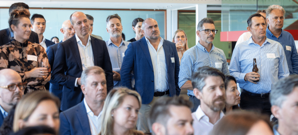 An audience listening to a speaker