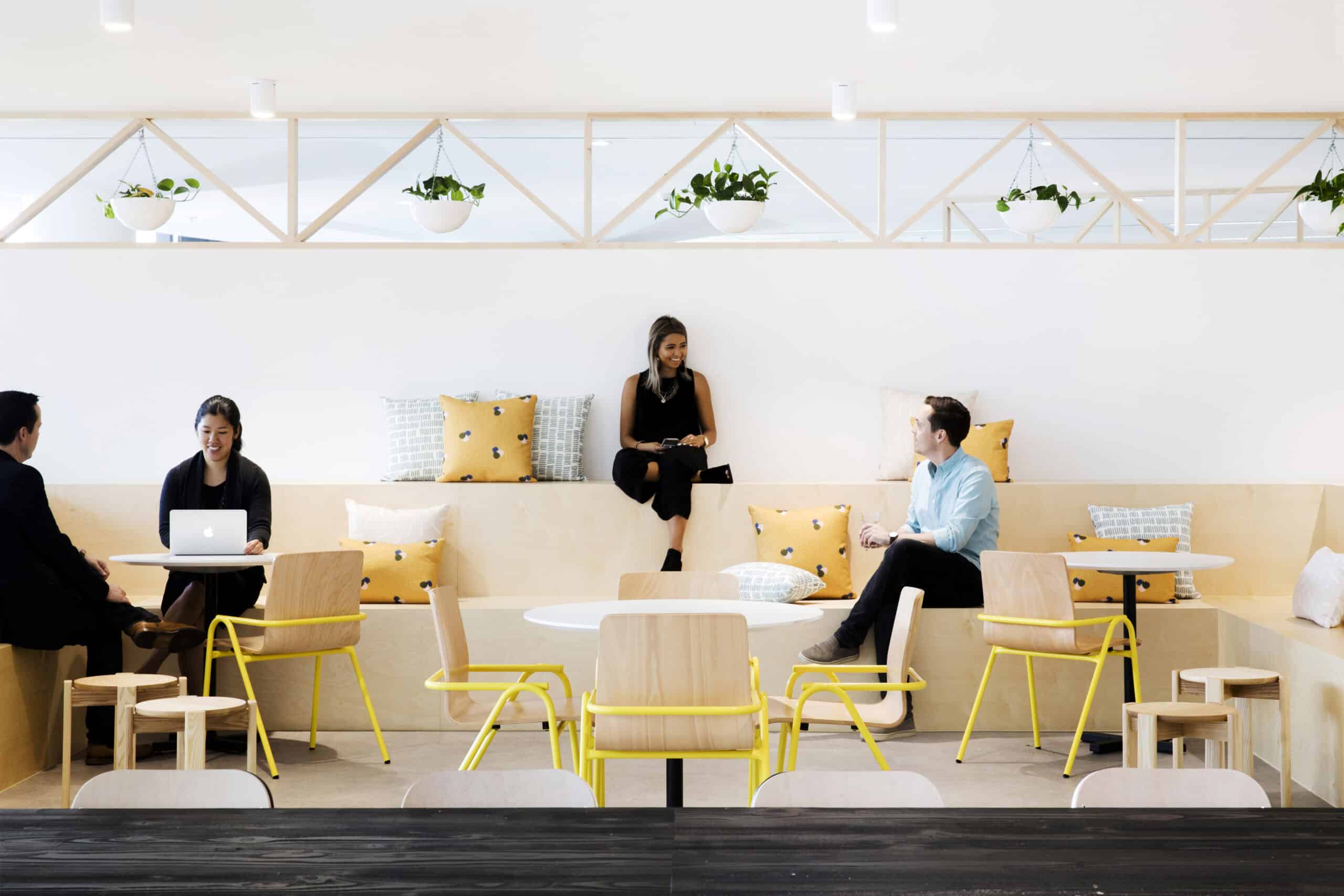 Collaborative workplace breakout space with flexible seating, biophilic design, and modern office fitout for employee wellbeing and teamwork