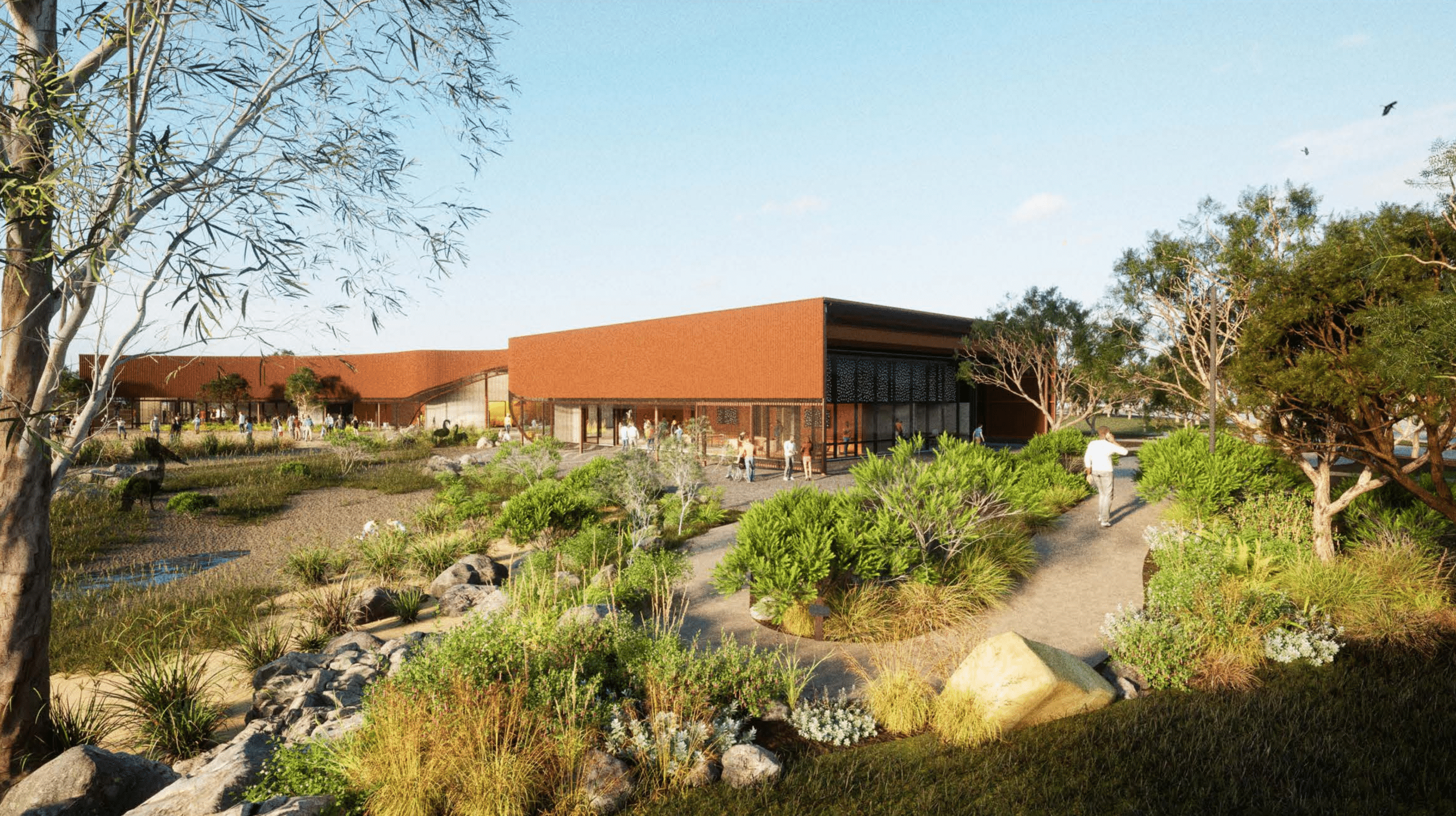 Contemporary building within landscaped native garden with walking paths and visitors