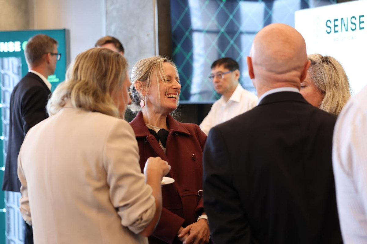 Industry professionals connecting and laughing during networking break at Green Building Forum 2025